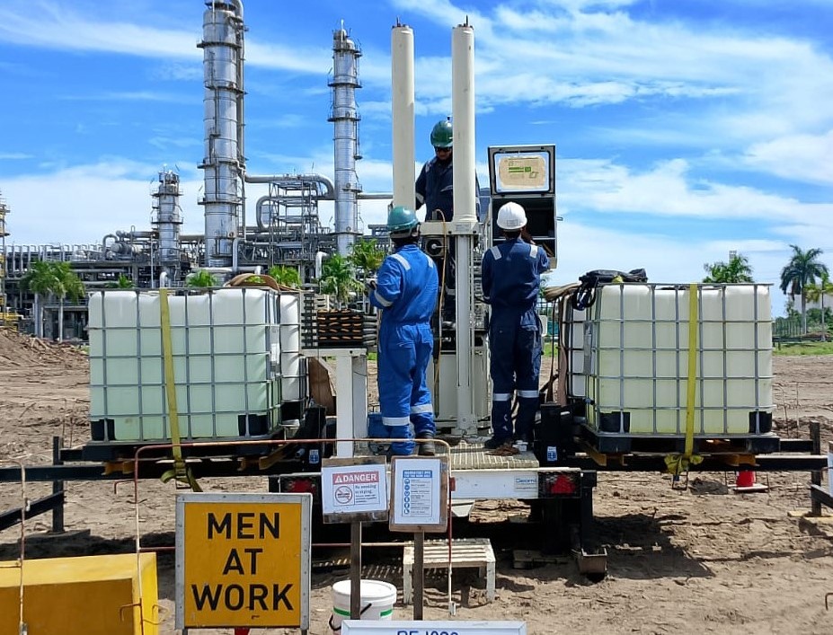 Engineers reviewing soil and materials testing samples